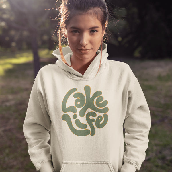 Embrace the serene vibe of lakeside living with our "Lake Life" Hoodie, a perfect blend of comfort and nostalgia. Crafted with a nod to the laid-back, timeless appeal of lake life, this hoodie features the phrase "Lake Life" prominently displayed in a charming retro font that evokes memories of sunny days spent by the water, laughter-filled evenings around campfires, and the soothing tranquility of nature.
